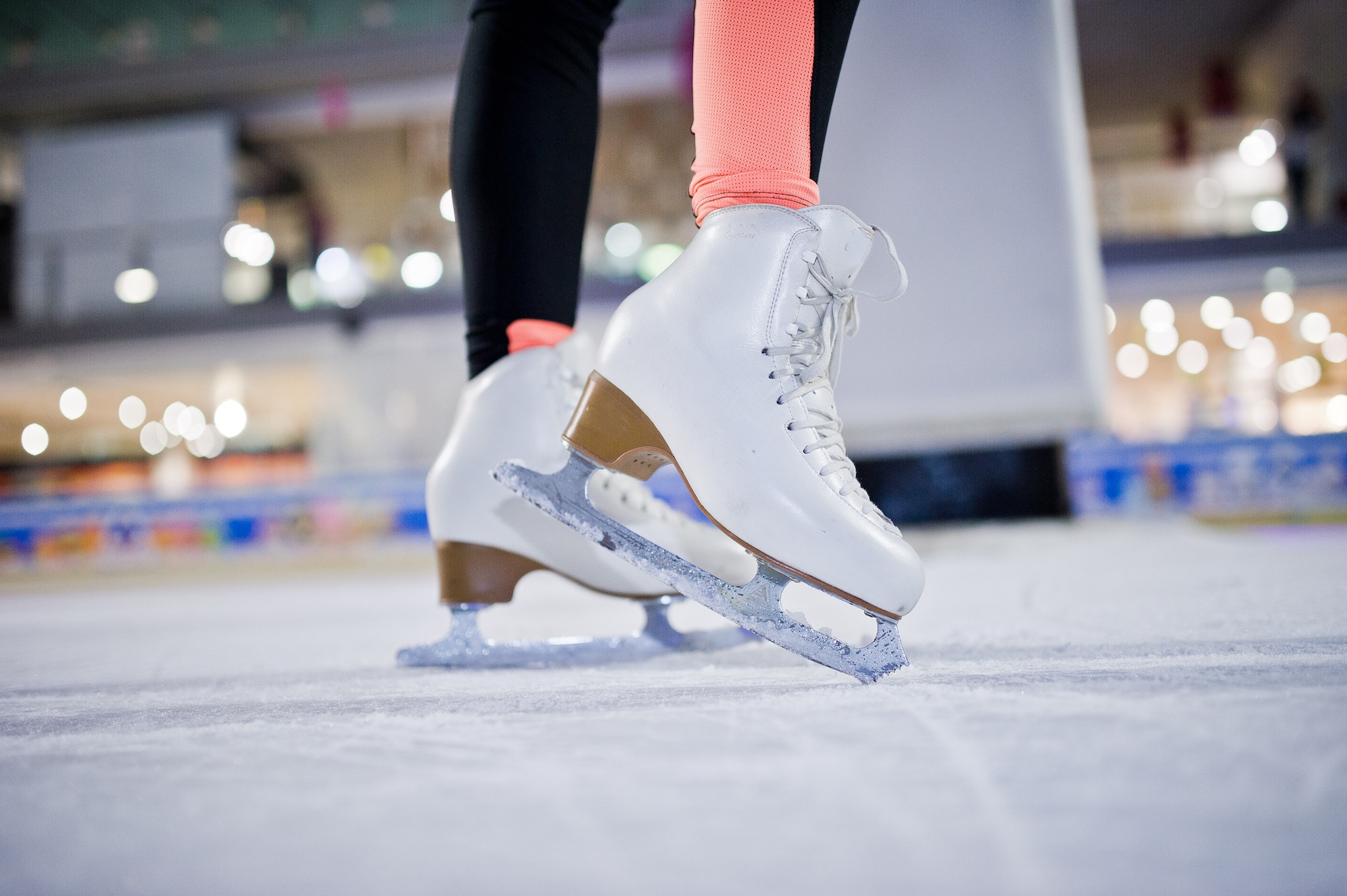 Figure skater woman at ice skating rink. Figure skater woman at ice skating rink.