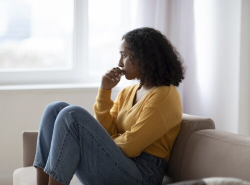 Mental Health Care. Depressed Young Black Woman Suffering From Emotional Burnout On Couch At Home